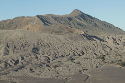 Scenic view of desert against clear sky