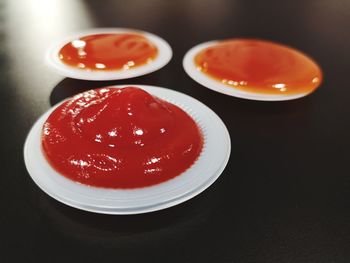 High angle view of red juice on table