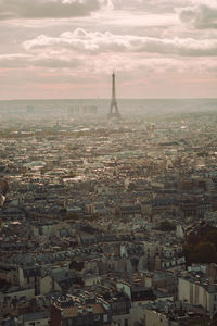 High angle view of city against cloudy sky