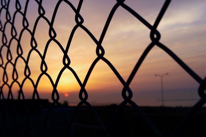 chainlink fence, sunset, protection, safety, fence, security, metal, focus on foreground, orange color, sky, silhouette, scenics, close-up, beauty in nature, tranquility, sea, water, nature, metallic, no people