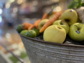 Close-up of fruits in container at market stall