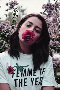 Portrait of woman with red flowers