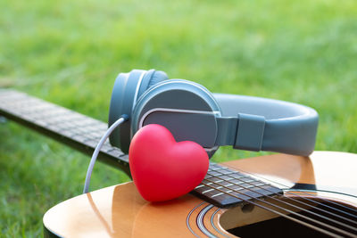 Close-up of guitar on table at park