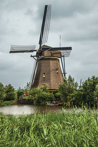 Traditional windmill against sky