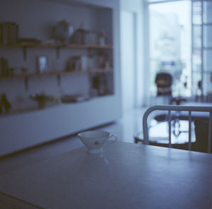 Close-up of coffee cup on table at home