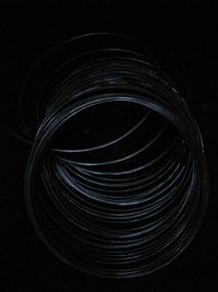 Close-up of spiral light against black background