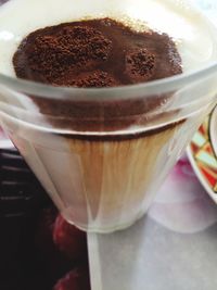 Close-up of coffee cup on table