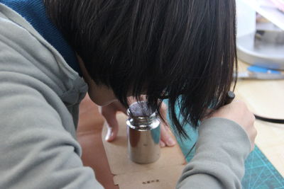 Rear view of two women on table