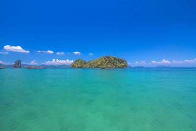 Scenic view of sea against blue sky