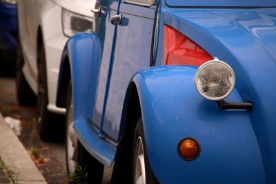 View of blue car on street