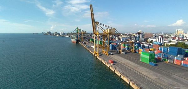 Pier at harbor against sky