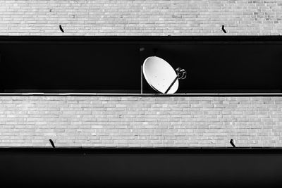 Low angle view of satellite dish on wall