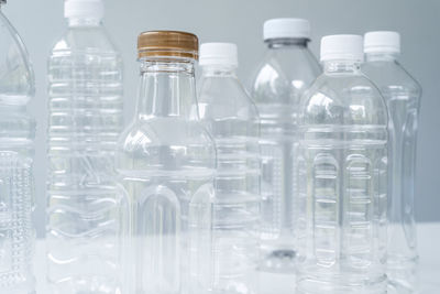 Close-up of glass bottles on table