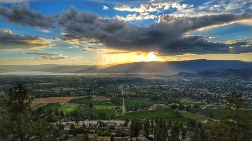 Town against sky during sunset