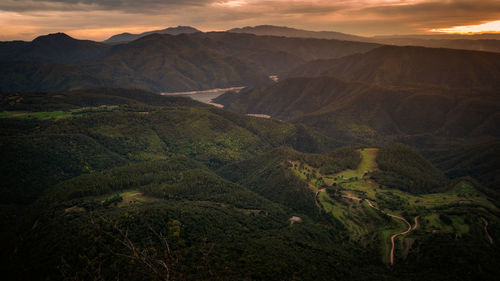 Scenic view of landscape against sky during sunset