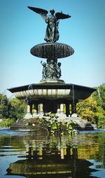 View of fountain against blue sky