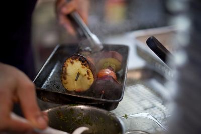 Midsection of person preparing food