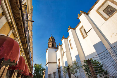 Low angle view of buildings against blue sky