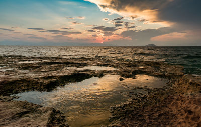 Scenic view of sea against sky during sunset