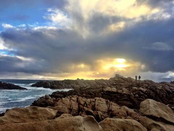 Scenic view of sea against cloudy sky