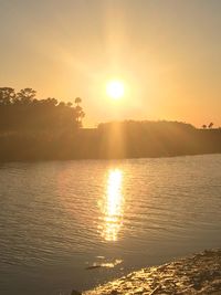 Scenic view of sunset over river