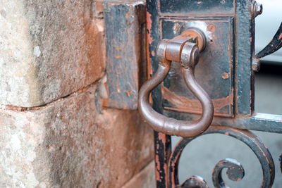 Close-up of rusty metal gate