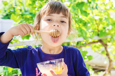 Portrait of cute girl eating food