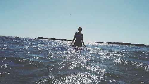 Scenic view of calm sea against clear sky