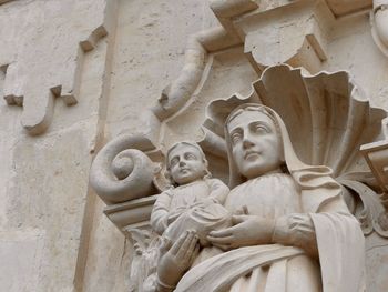 Low angle view of statues on building