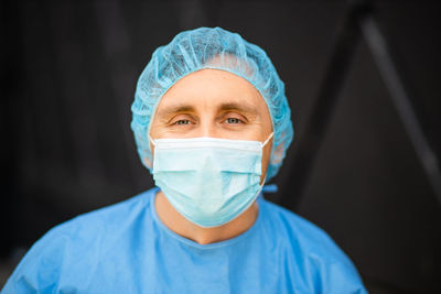 Portrait of man wearing surgical mask