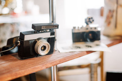 Close-up of camera on table