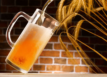 Close-up of beer glass on table