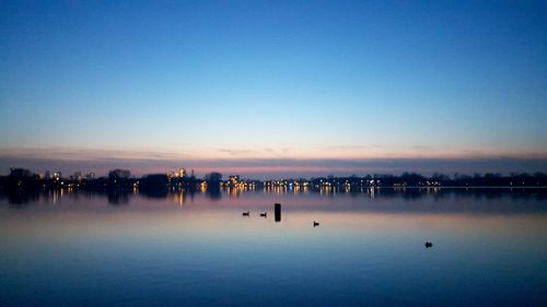 Scenic view of lake at sunset