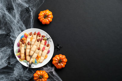 High angle view of orange on table against black background