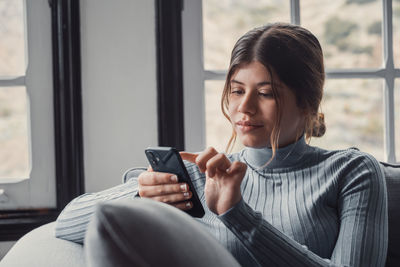 Young woman using mobile phone