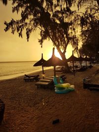 Scenic view of beach against sky during sunset