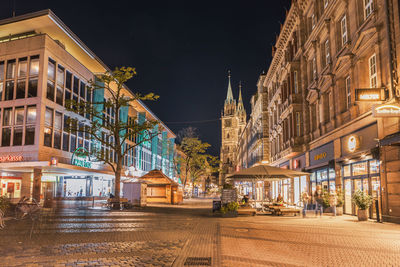 Buildings in city at night