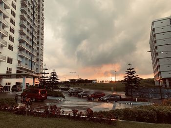 Traffic on road against buildings in city