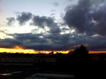 Silhouette of landscape against cloudy sky