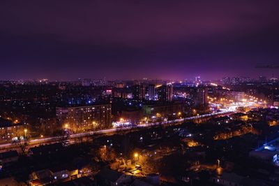 High angle view of illuminated city buildings at night