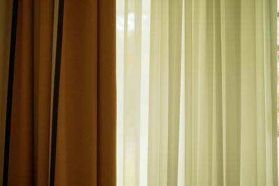 Old white and brown curtain with backlight