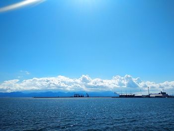 Scenic view of sea against blue sky