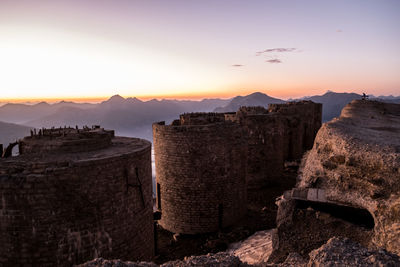Panoramic view of castle against sky during sunset