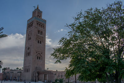 Low angle view of clock tower against sky
