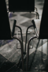 Close-up of empty chairs on floor