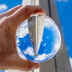 Close-up of hand holding crystal ball