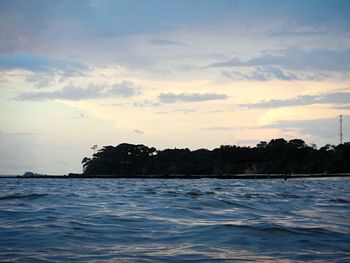 Scenic view of sea against sky at sunset