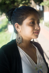 Portrait of young woman looking away