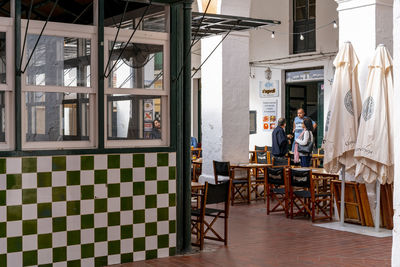 Chairs and table at entrance of building