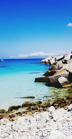 Scenic view of sea against blue sky